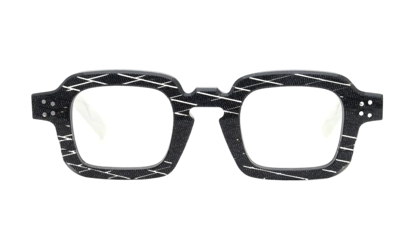 Black eyeglasses with a geometric pattern on a white background