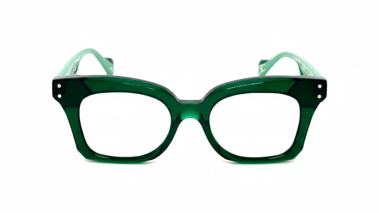 Green eyeglasses with light green temple tips on a white background