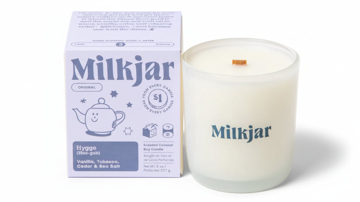 Milkjar candle and packaging on a white background