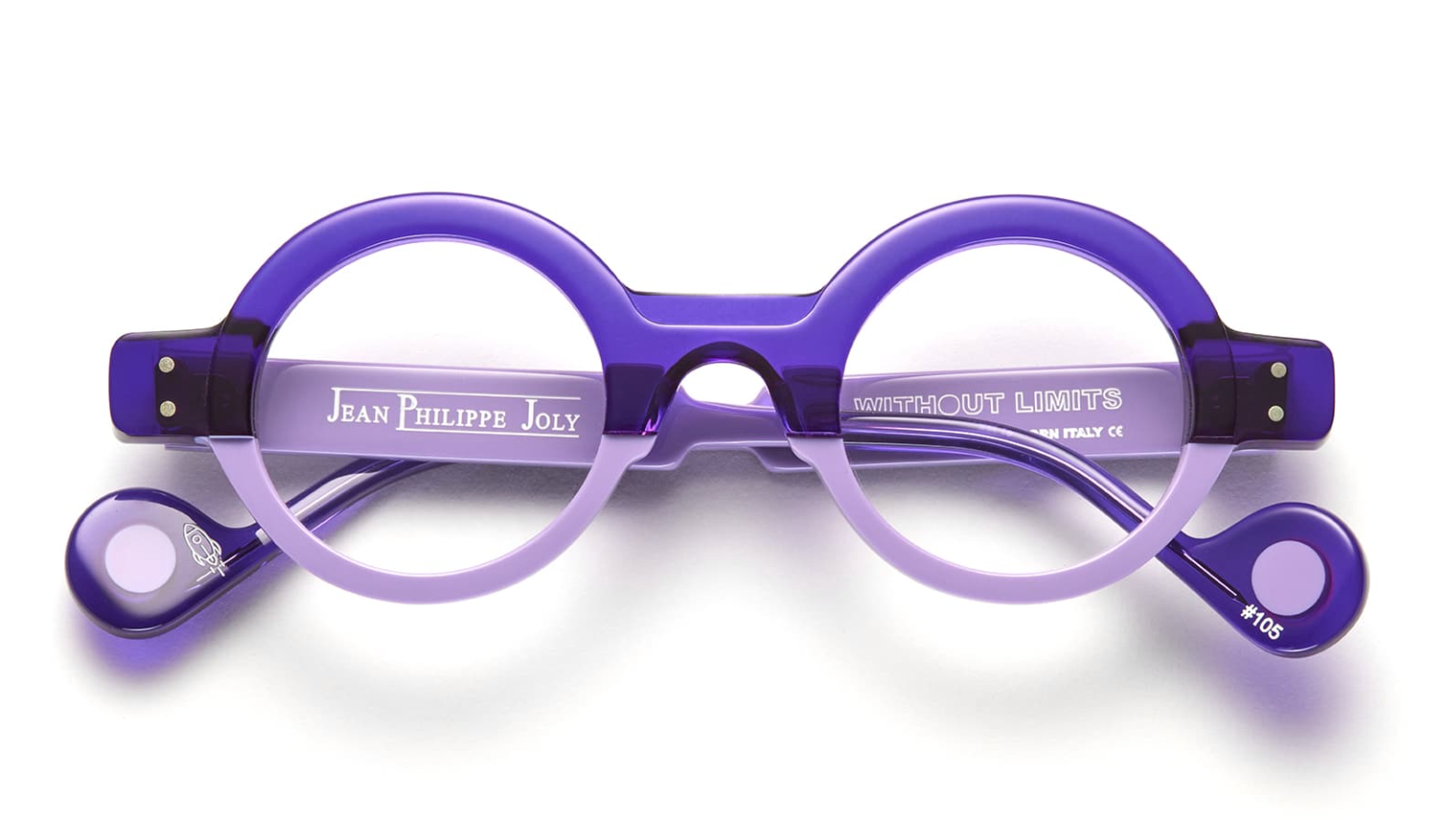 Purple eyeglasses with 'Jean Philippe Joly' branding on a white background