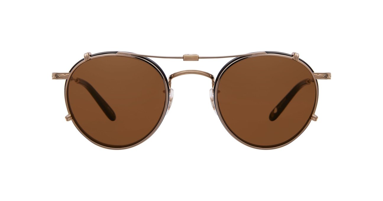 A bronze Garrett Leight stainless steel folding sun clip with brown tinted lenses, designed to attach to Wilson eyeglasses, displayed against a plain background.