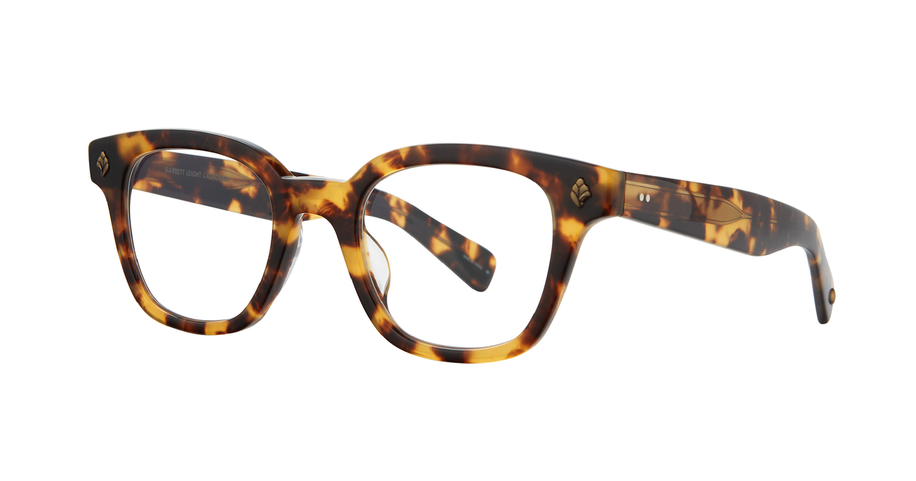 With rich materials and a bold silhouette, the Naples Bio Spotted Tortoise eyeglass frame infuses a modern design with vintage sensibility. Palm leaf plaques embellish the exaggerated end pieces for a look that's equal parts minimal and striking. Select colorways are crafted from the new bio-based acetate. Hand Finished in LA. 